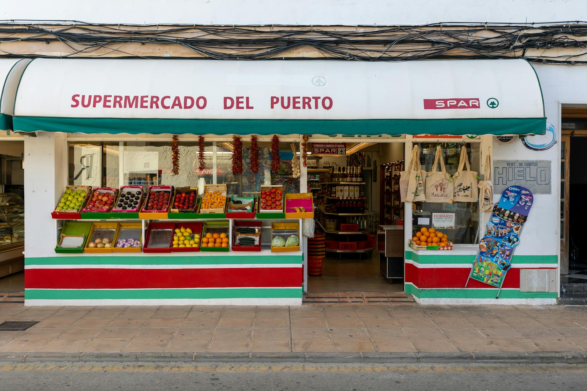 A well lit grocery store aisle with clear signage.