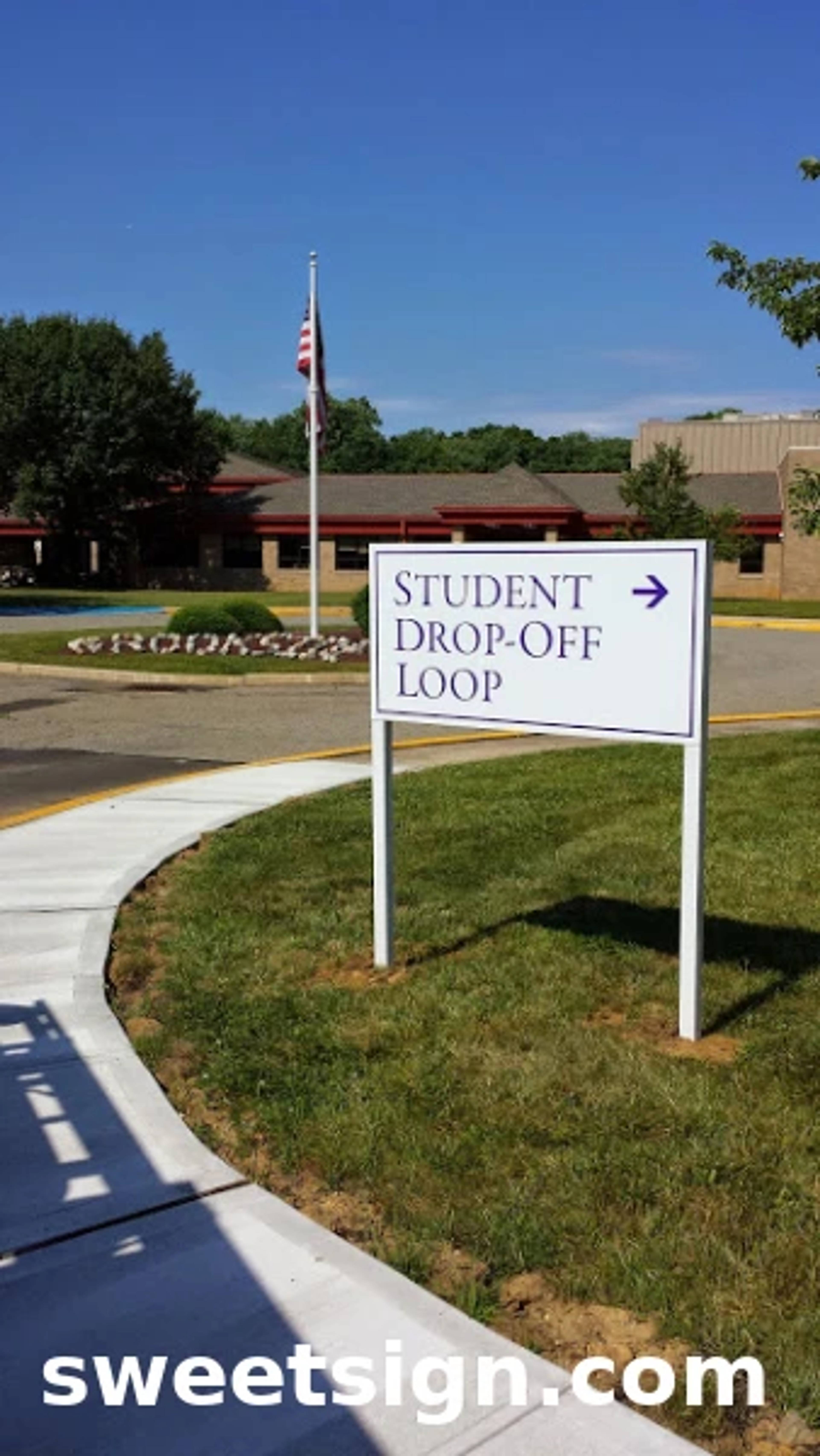 Monroe Schools student drop-off loop sign