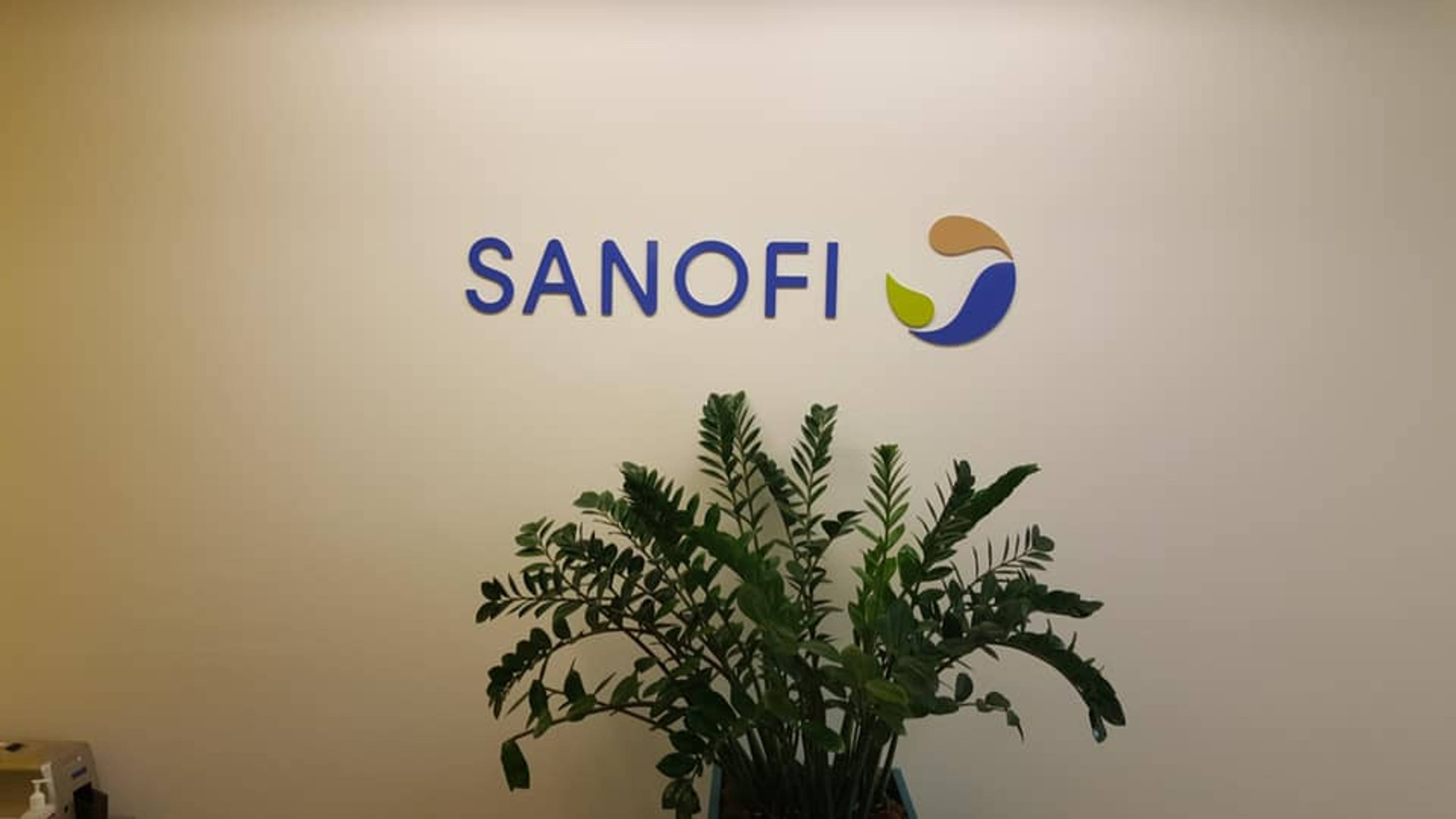 Sanofi office wall sign with modern logo, professional corporate interior signage