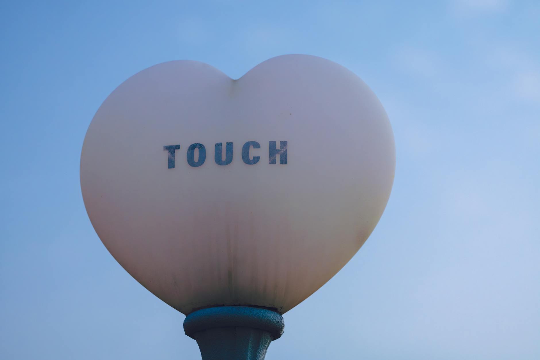 A modern monument sign at the entrance to a corporate building in Edison, NJ.
