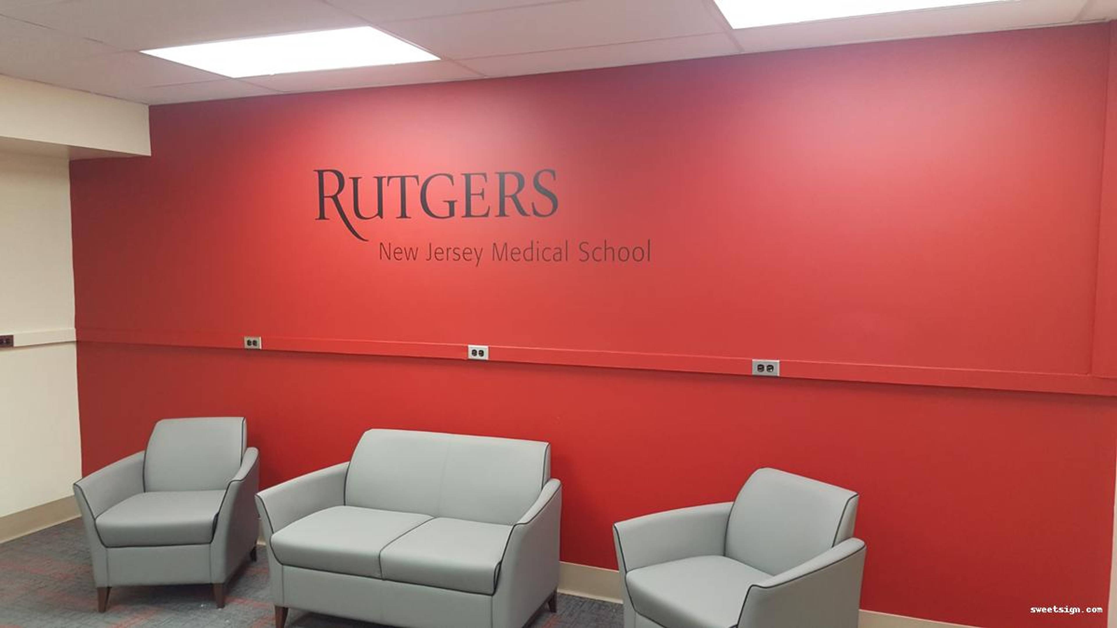 Rutgers New Jersey Medical School red feature wall with seating area