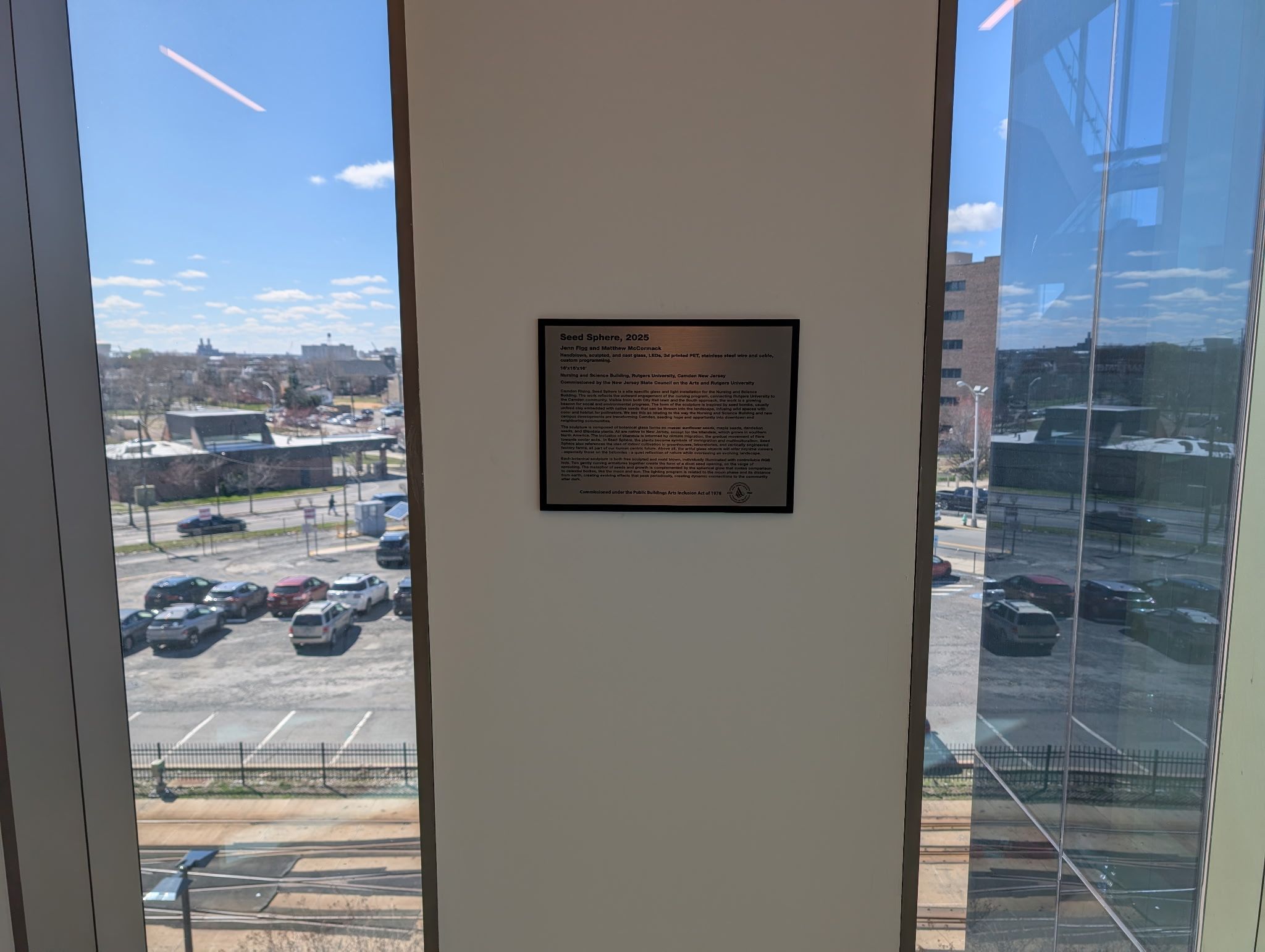 Plaque explaining a sculpture and artists prior work