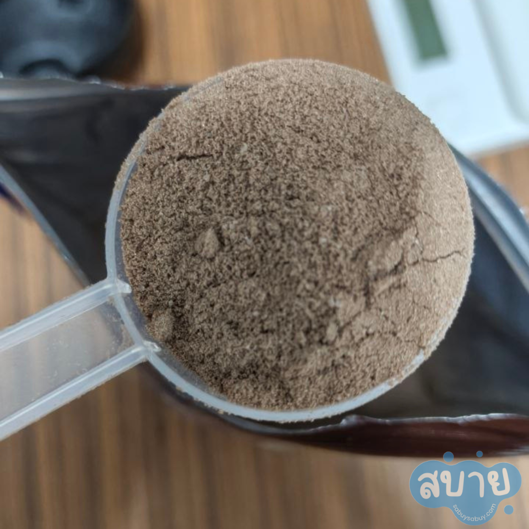 ผงโปรตีนภายในช้อนตวงของ