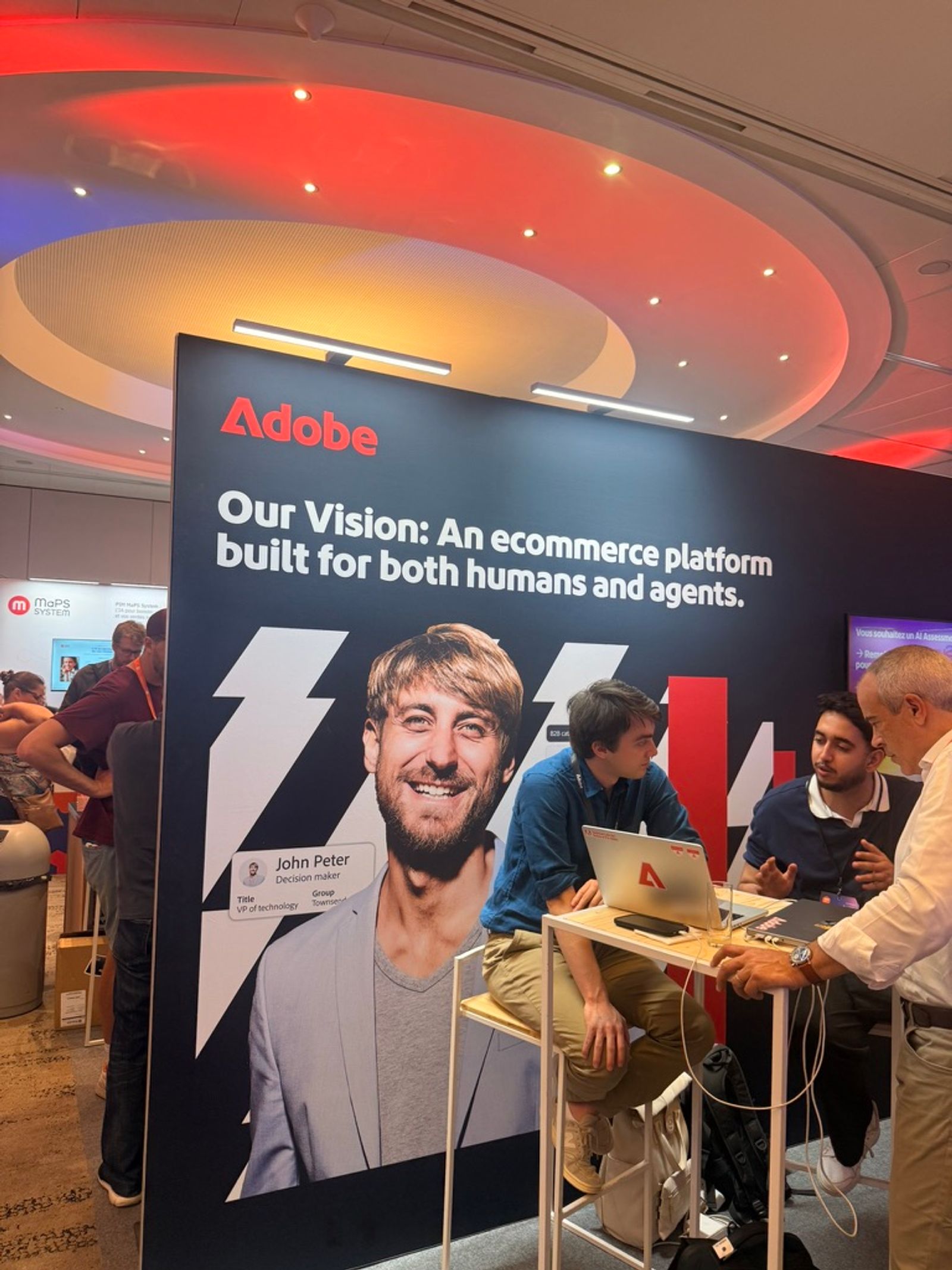 The Adobe Commerce booth at MM France 2026 with the tagline: Our Vision, an ecommerce platform built for both humans and agents.