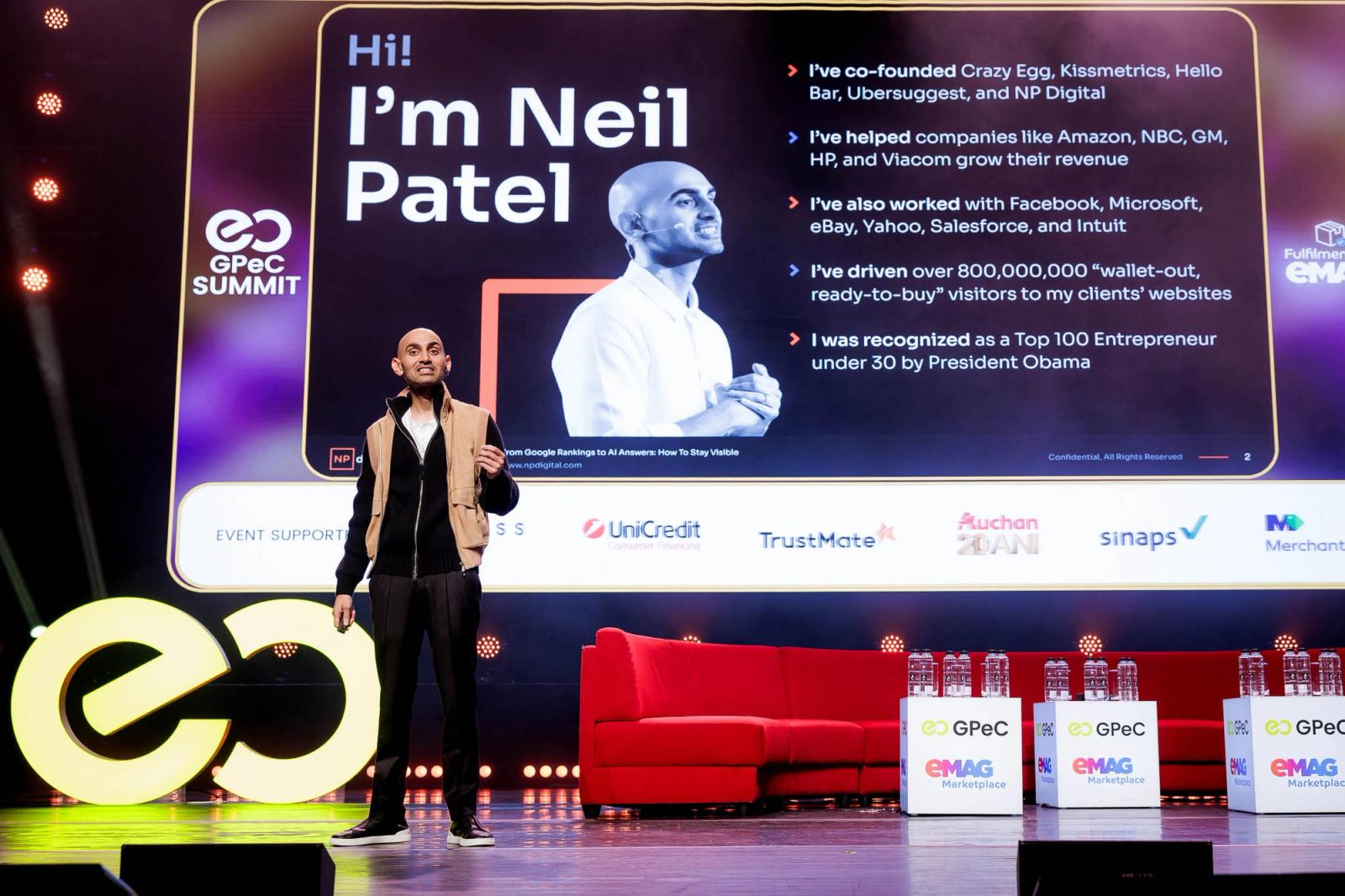 Neil Patel on the GPeC SUMMIT stage on 13 October 2026, next to his Hi! I'm Neil Patel slide.