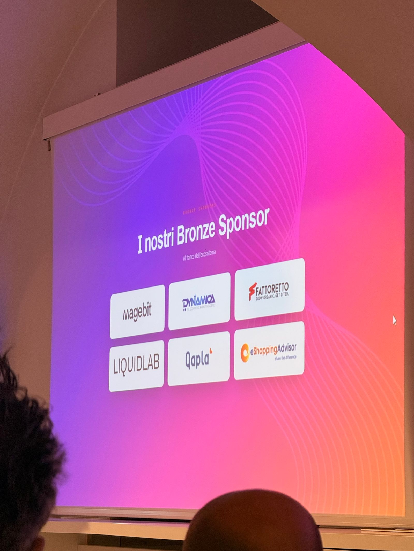 The “I nostri Bronze Sponsor” slide at Meet Magento Italy 2026 in Florence, showing the logos of Magebit, Dynamica, Fattoretto, LIQUIDLAB, Qapla' and eShoppingAdvisor.
