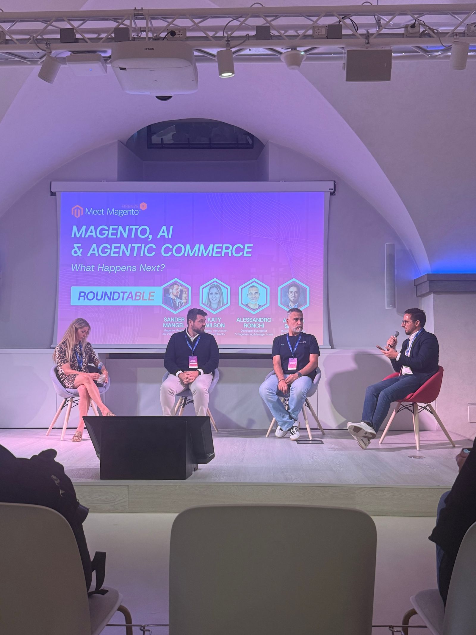 The Meet Magento Italy 2026 closing roundtable “Magento, AI & Agentic Commerce: What Happens Next?” with Katy Wilson, Sander Mangel, Alessandro Ronchi and Andrea Saccà on stage.