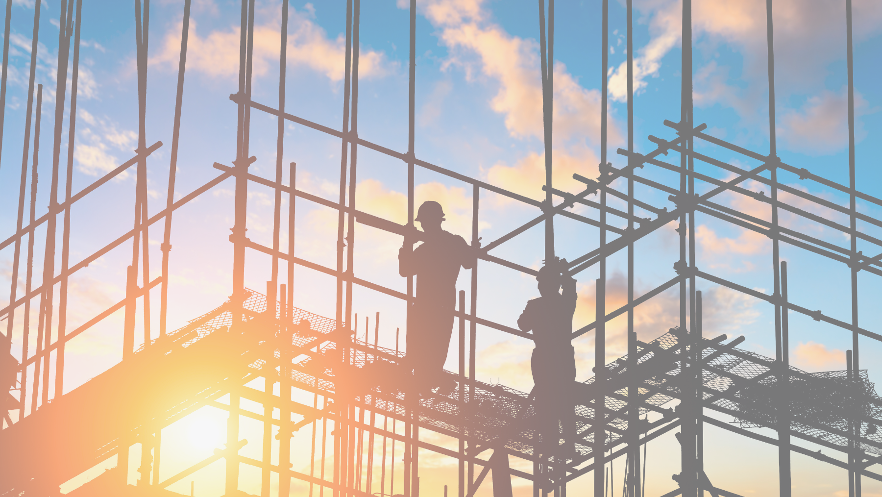 Construction site photo featuring two workers