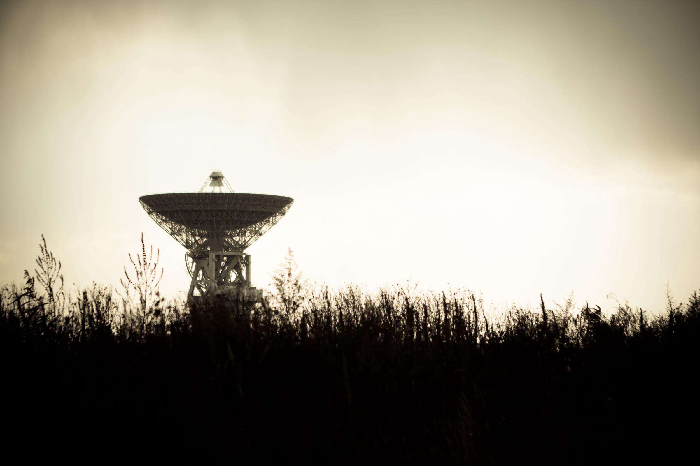 A satellite dish pointing at the sky.