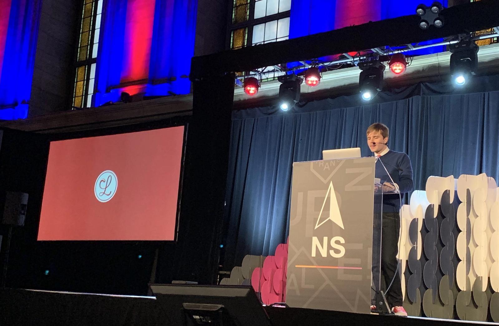 mb onstage at NSNorth in front of a slide with the Lickability logo