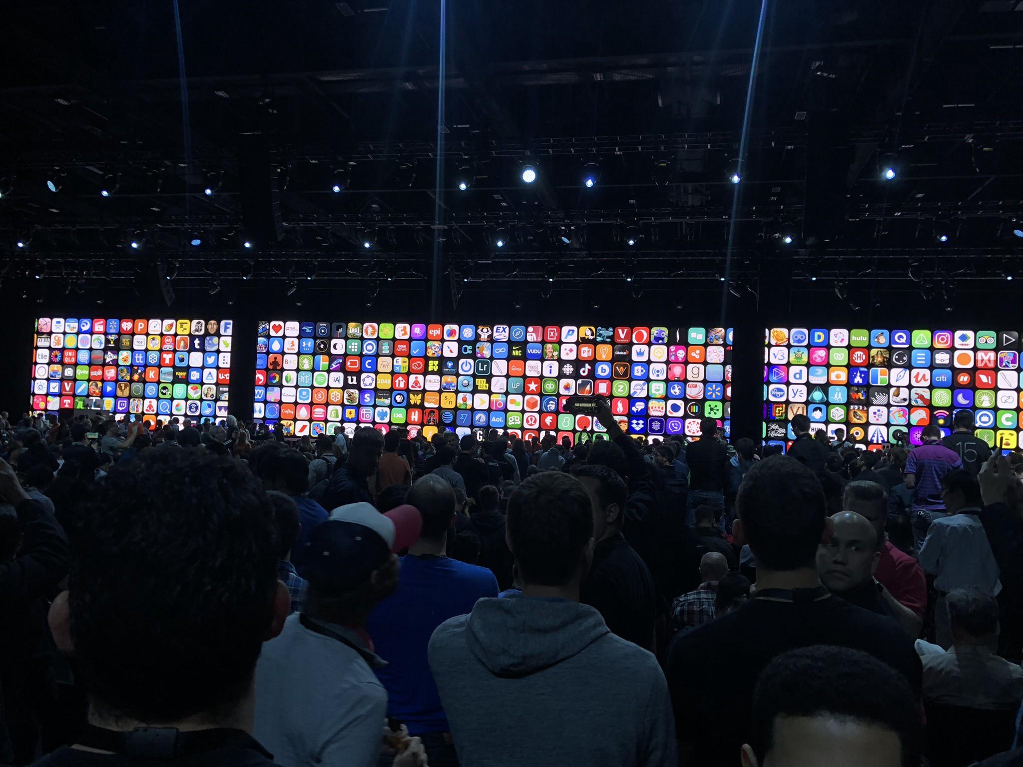 A photo from the opening keynote of WWDC 2018 showing a wall of app icons.