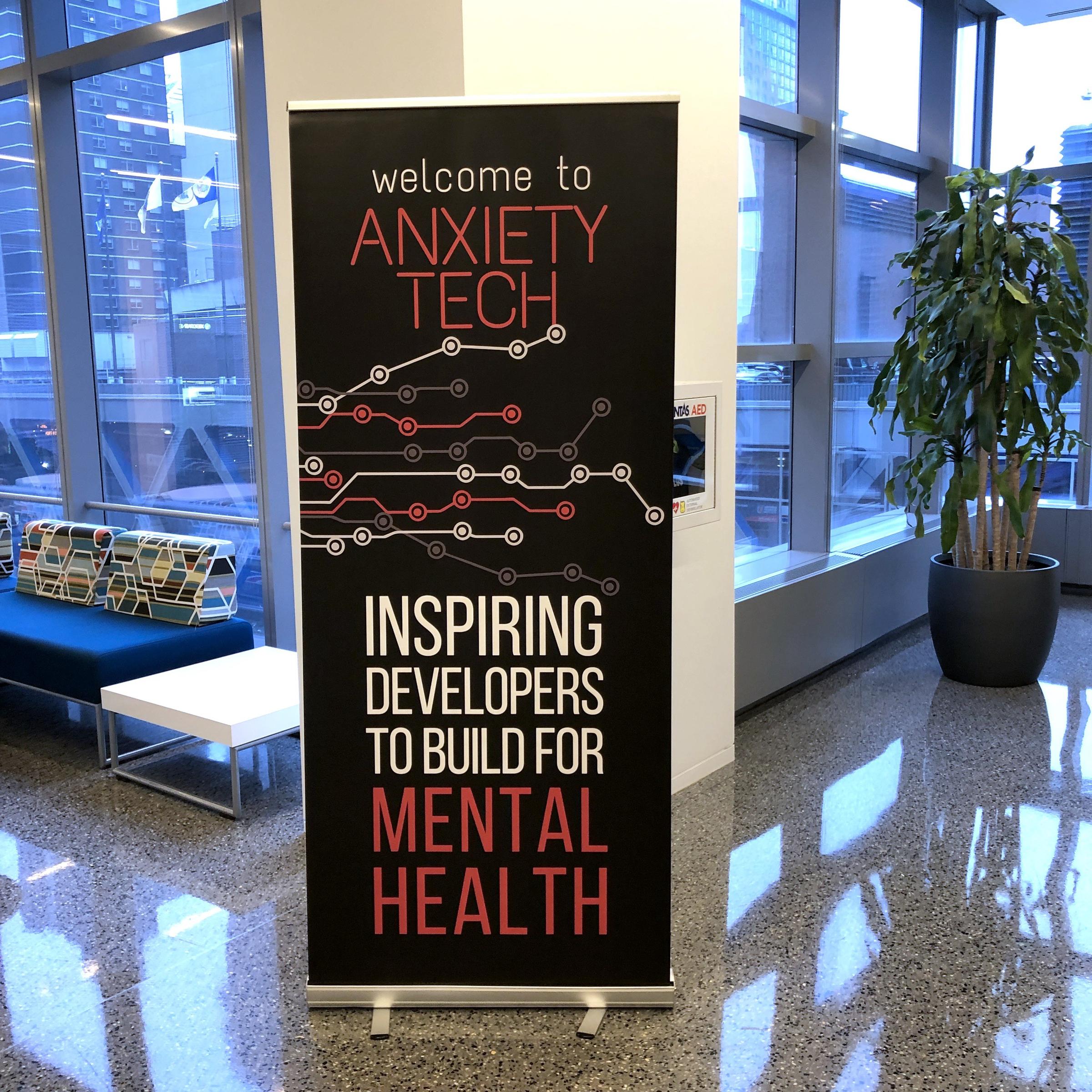 A sign at AnxietyTech that reads 'Inspiring developers to build for mental health'.