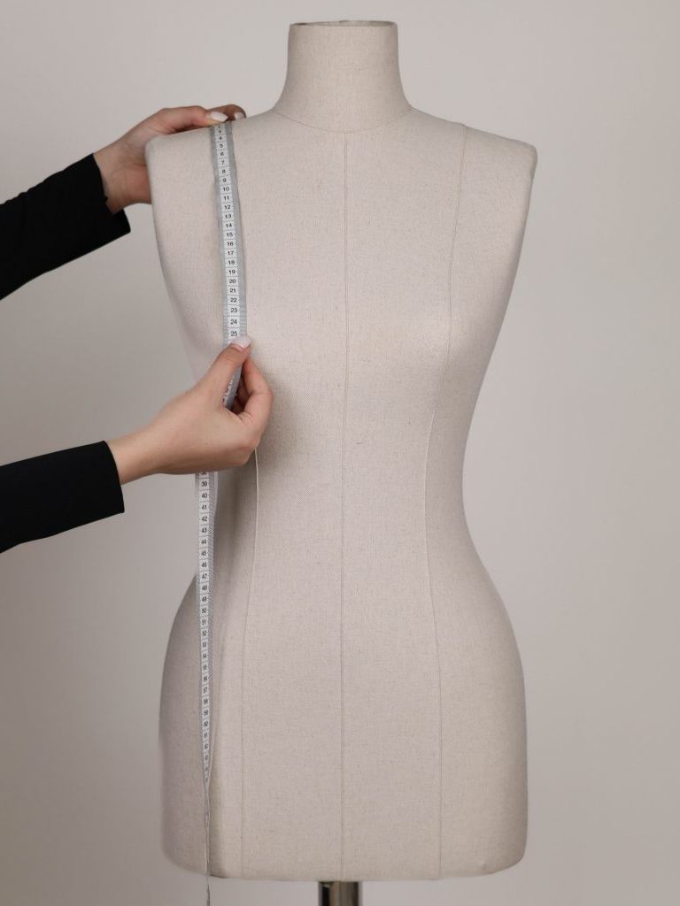 SHOULDER TO THE TIP OF THE BREAST