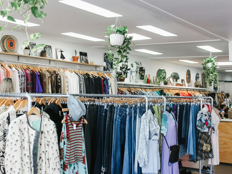 Dense rails of second-hand clothing in a store