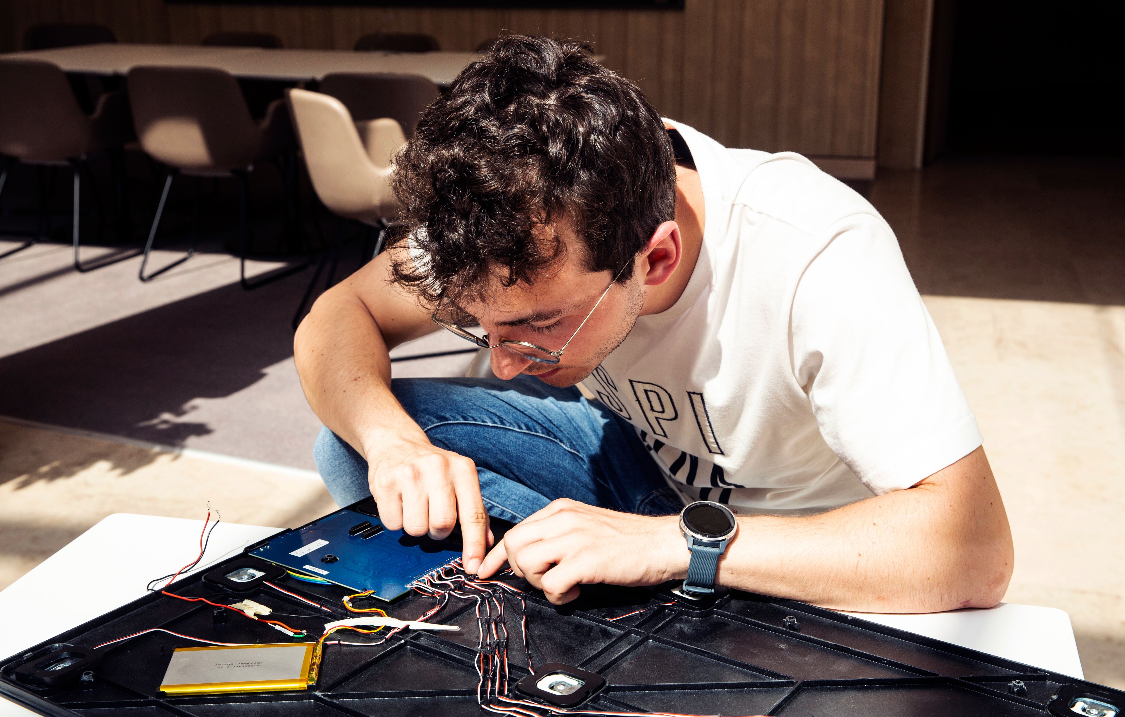 Man working on hardware of BBalance matscale