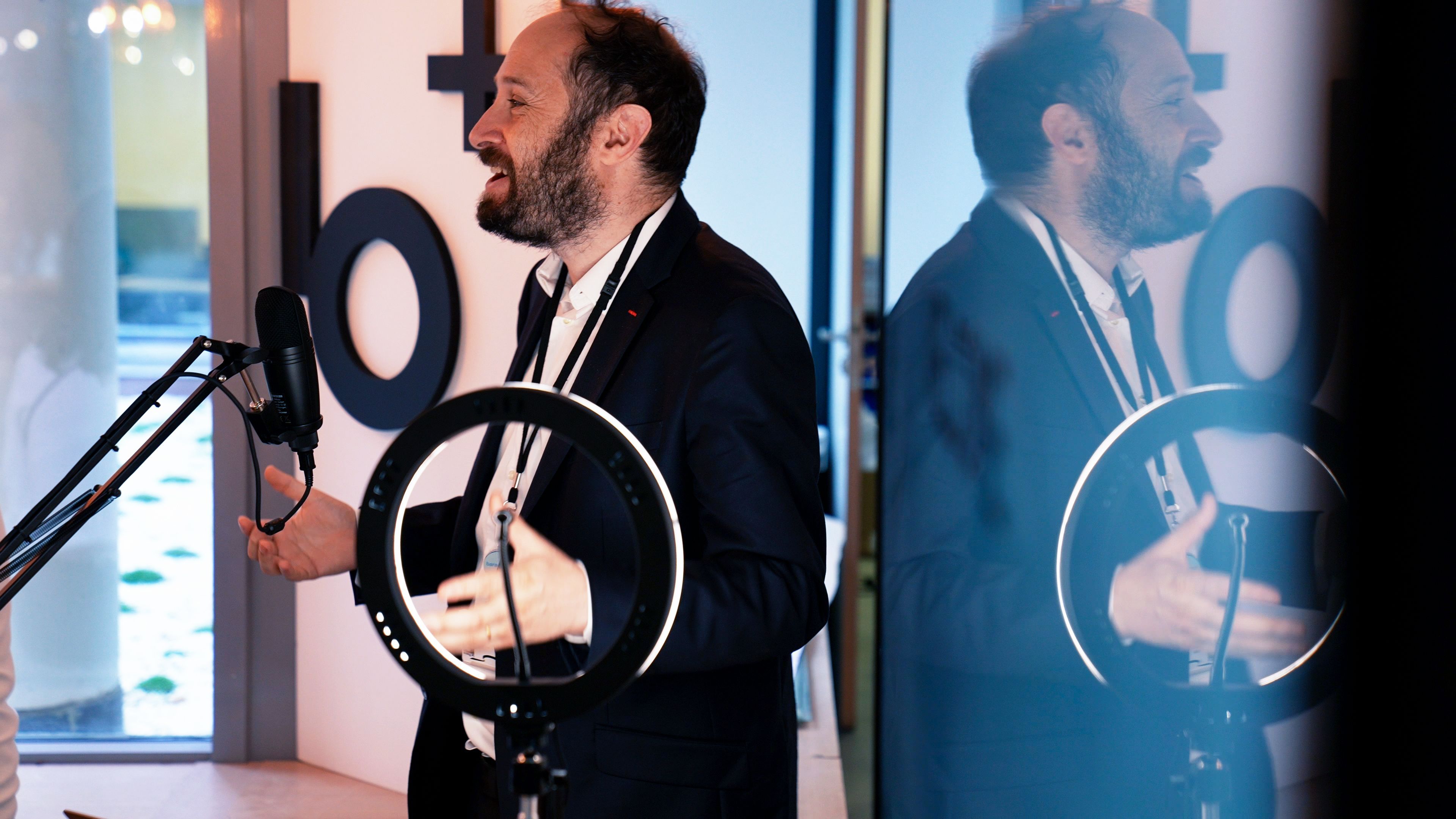 Baracoda CEO presenting in front of the company logo