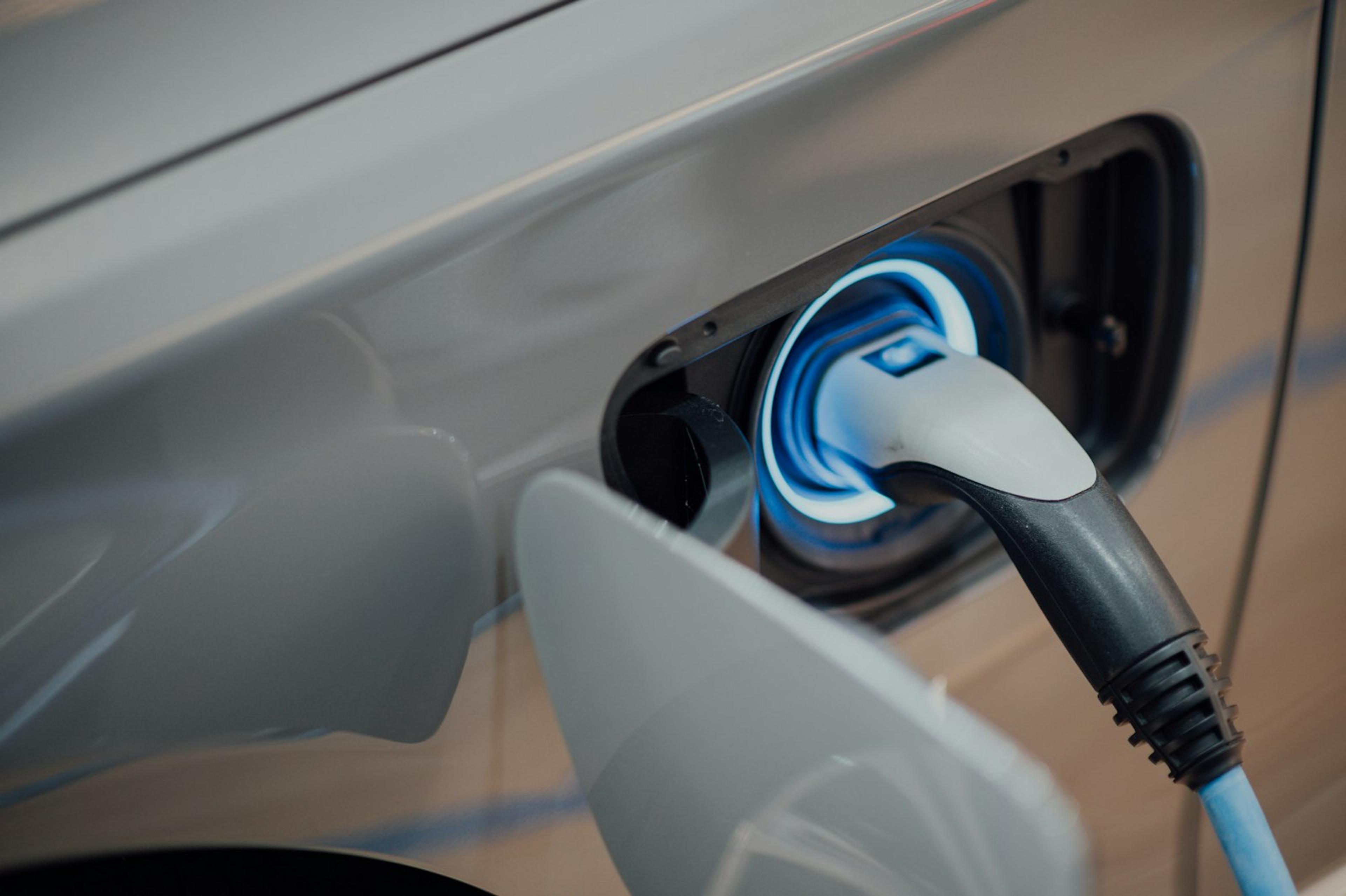 Electric vehicle charging at a home wall connector.