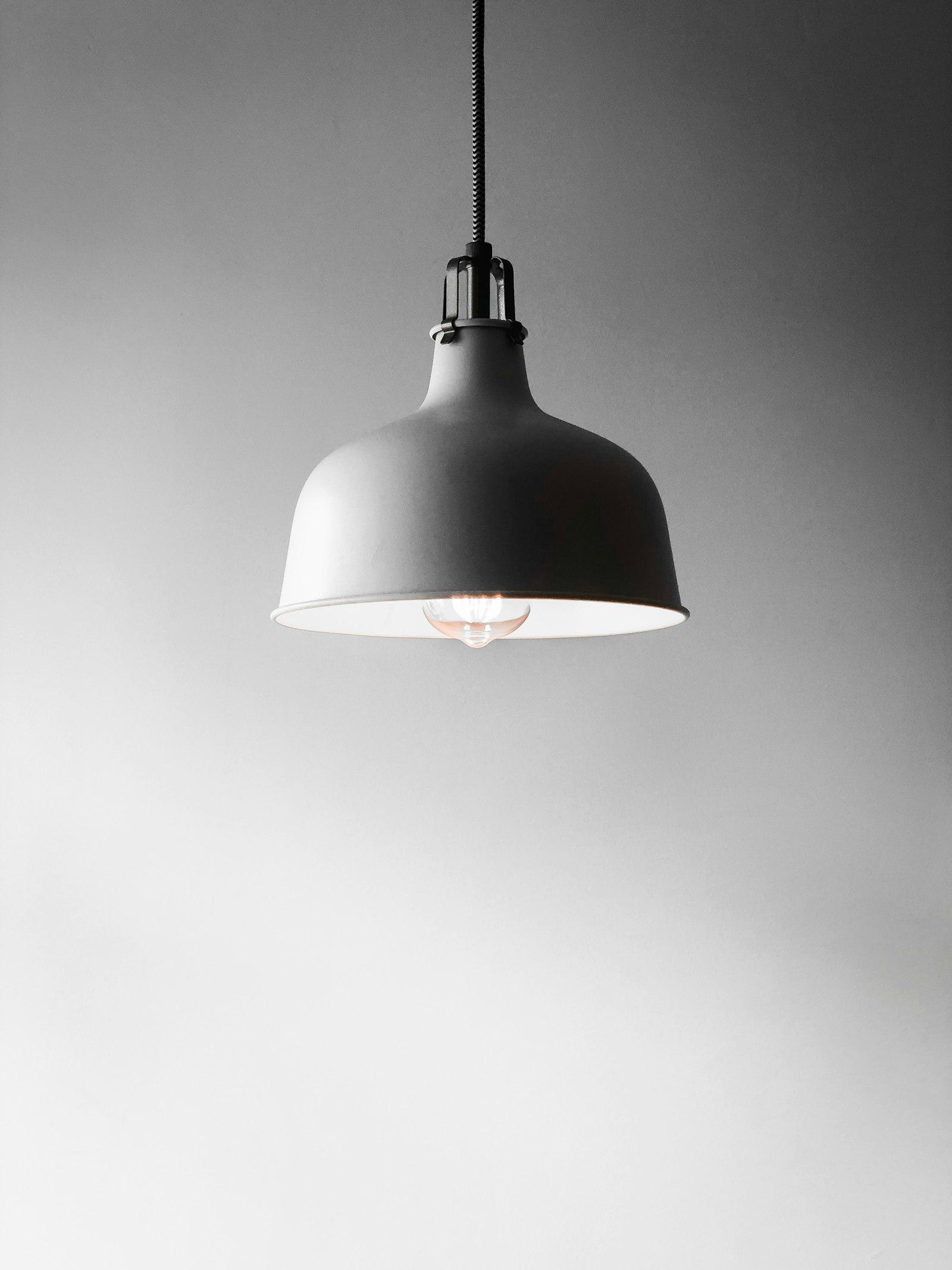 Recessed ceiling lights illuminating a modern living room.