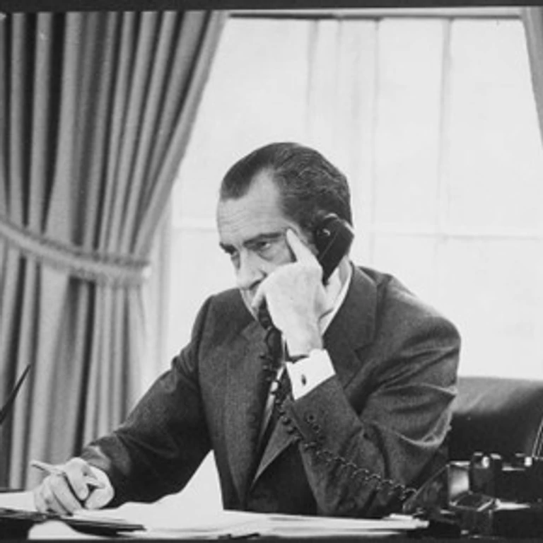 President Richard Nixon sitting in the Oval Office
