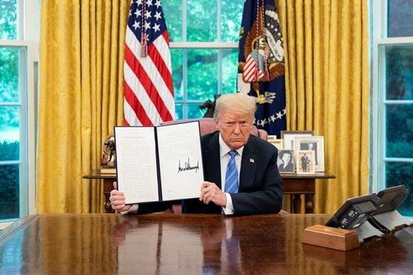 Image of Donald Trump and signed Executive Oreder Declaring a National Energy Emergency