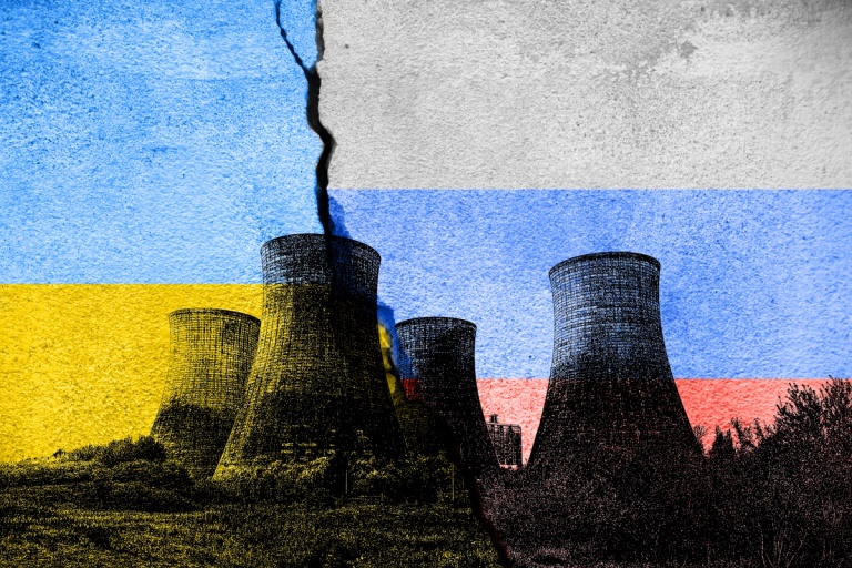 Image of nuclear power plant stacks with an overlay of a Ukrainian and Russian flag