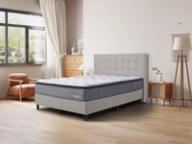 Dreamland Chelsea mattress, queen size, angled view in a styled bedroom.