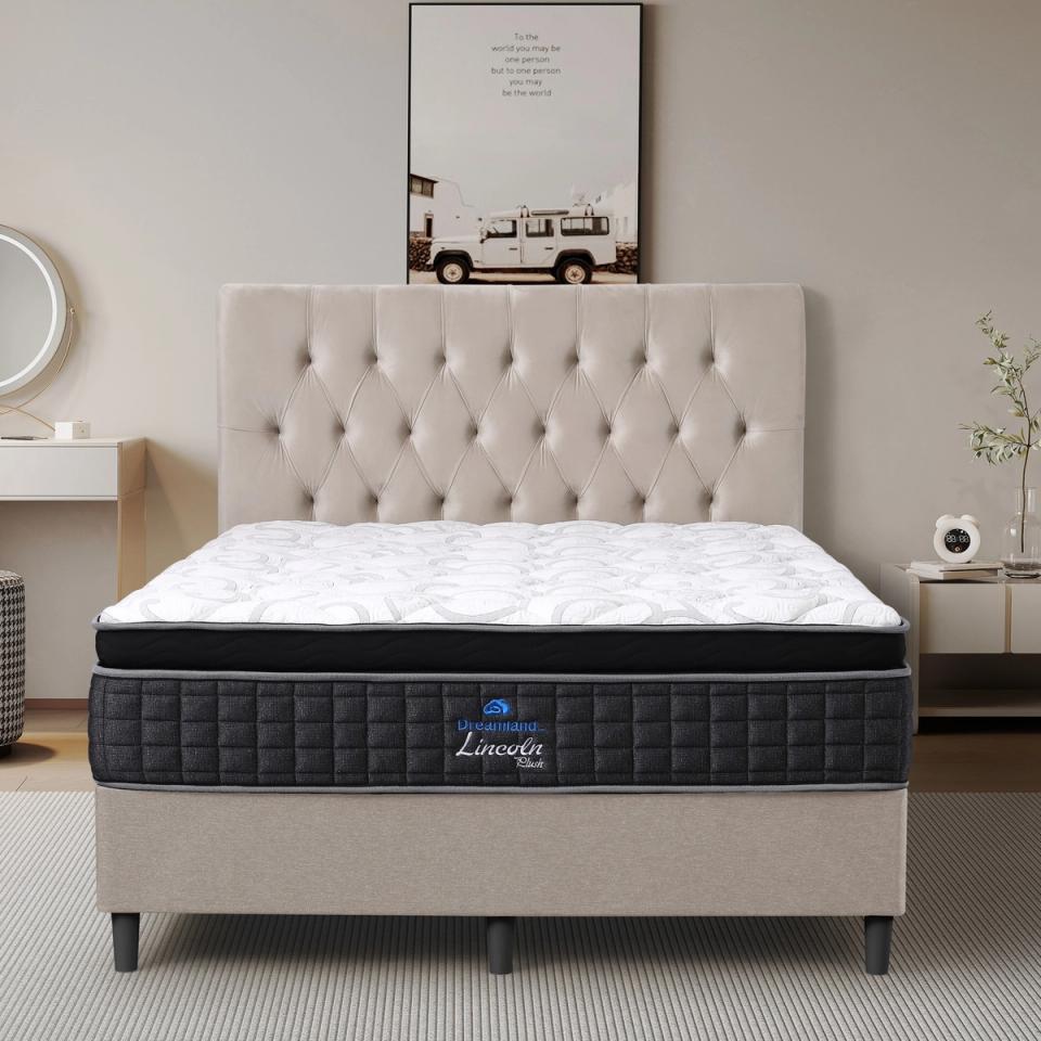 Dreamland Lincoln Plush mattress, queen size, shown front-on in a styled bedroom.
