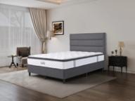 Dreamland Galaxy mattress, queen size, angled view in a styled bedroom.