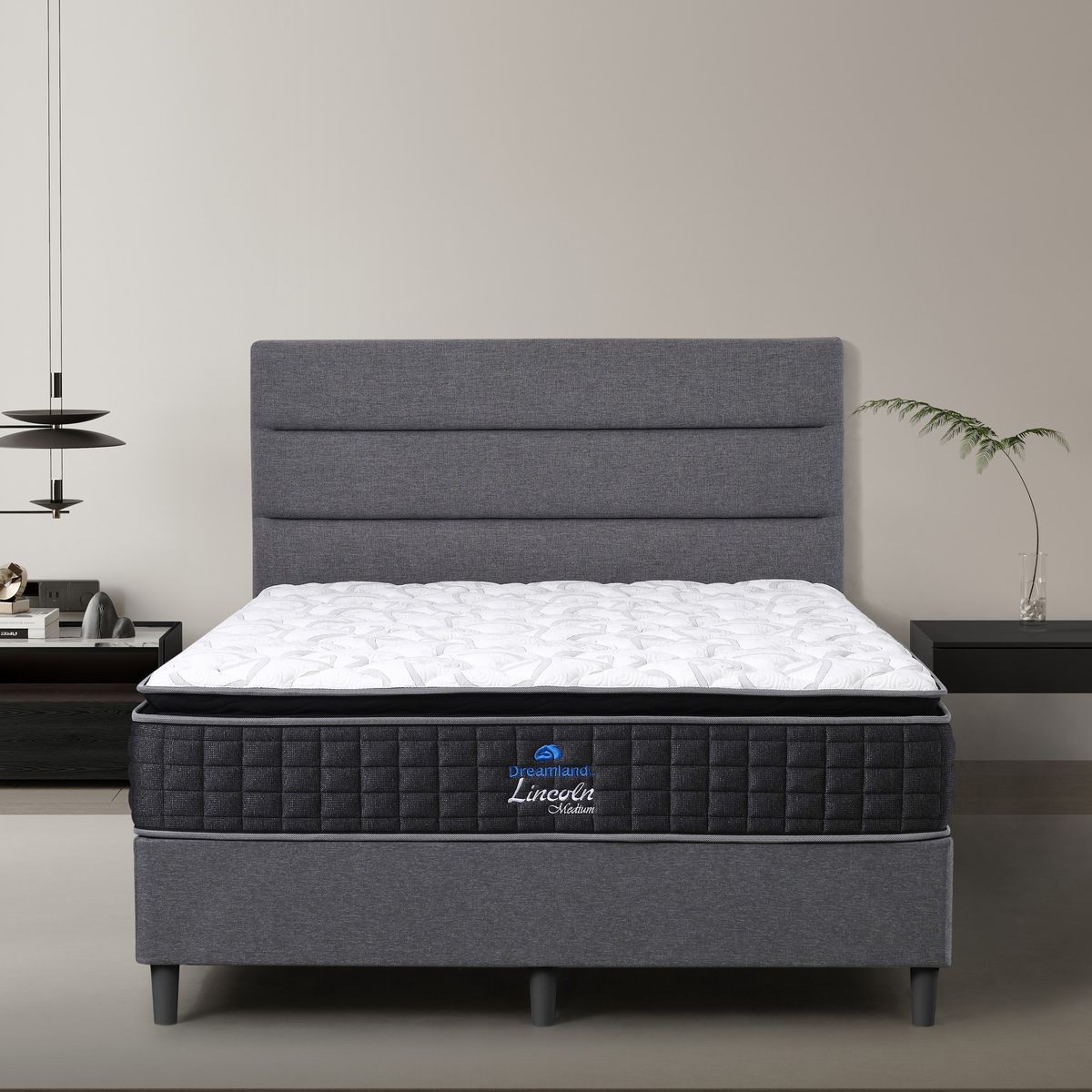 Dreamland Lincoln Medium mattress, queen size, shown front-on in a styled bedroom.