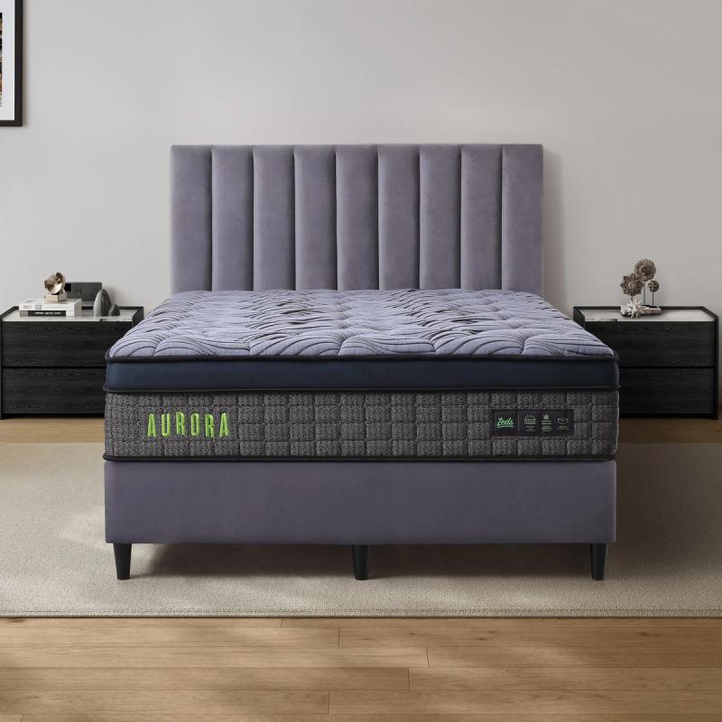 Dreamland Aurora mattress, queen size, shown front-on in a styled bedroom.
