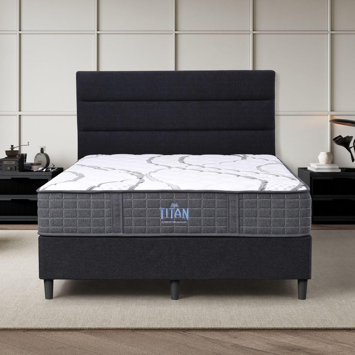 Dreamland Titan mattress, queen size, shown front-on in a styled bedroom.