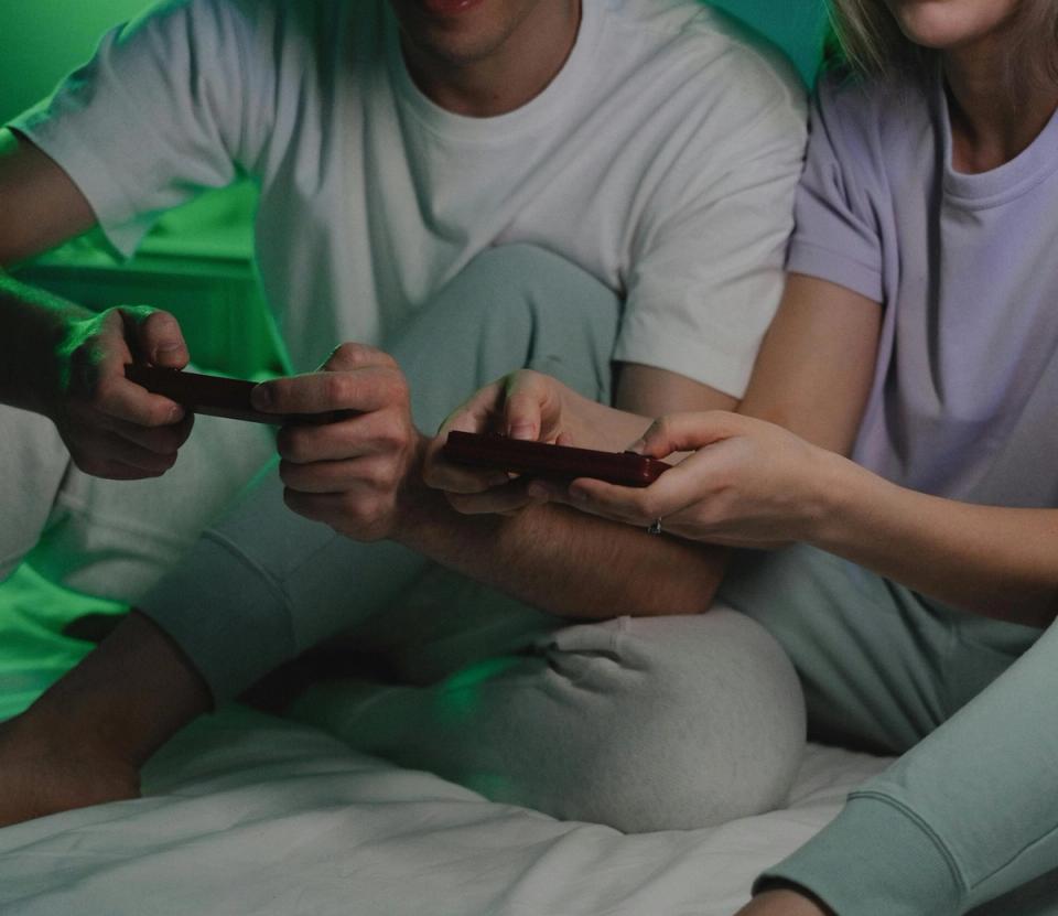 A gamer playing late at night, illustrating gaming and sleep