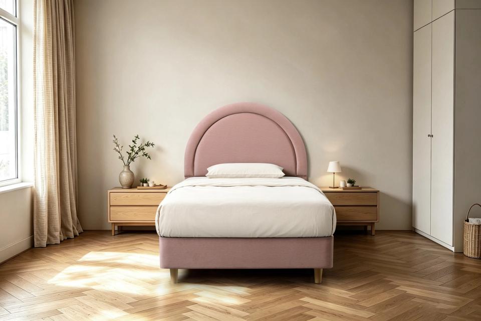 Mila upholstered king single bed frame in soft pink with an arched headboard