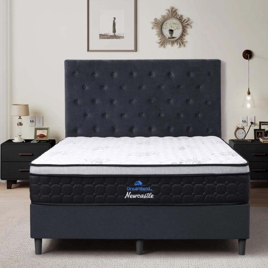 Dreamland Newcastle mattress, queen size, shown front-on in a styled bedroom.