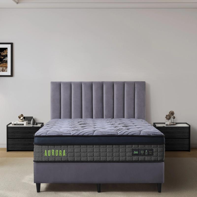 Dreamland Aurora mattress, queen size, shown front-on in a styled bedroom.