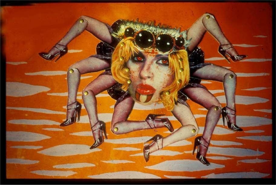 Martha Colburn, Spiders In Love: An Arachnogasmic Musical, 2000. Still from an animation on 16mm film: a collaged spider creature with a doll’s face on an orange background.