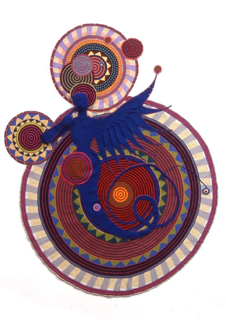 Xenobia Bailey, She Bop, She Boom, 1999. Hand crochet: a large mandala of concentric, brightly coloured rings with a blue figure.