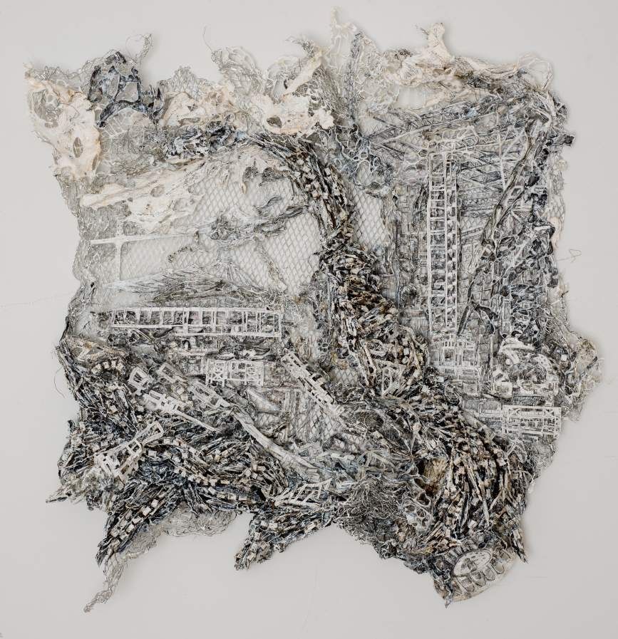 Dana Melamed, Engine 3.3, 2012. Mixed media on aluminum mesh: an intricate gray and white relief of layered industrial fragments.