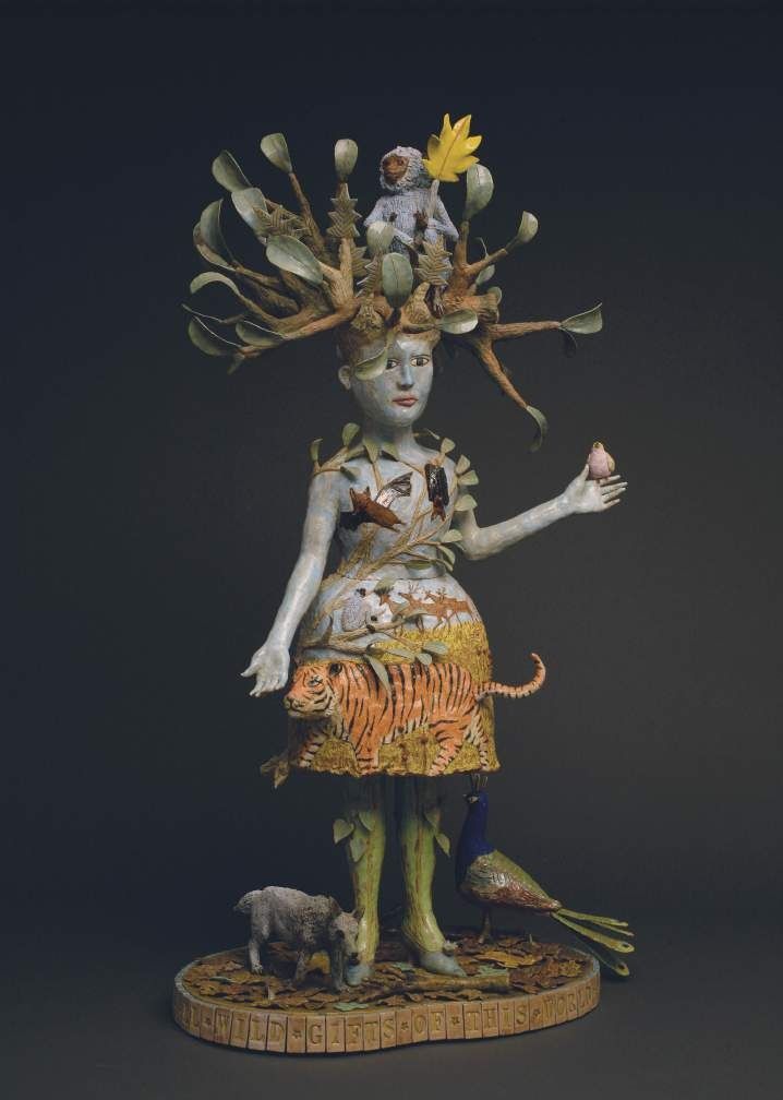 Kathy Ruttenberg, Gifts Of This World, 2012. Ceramic sculpture of a female figure with a tree-like headdress and a patterned dress.