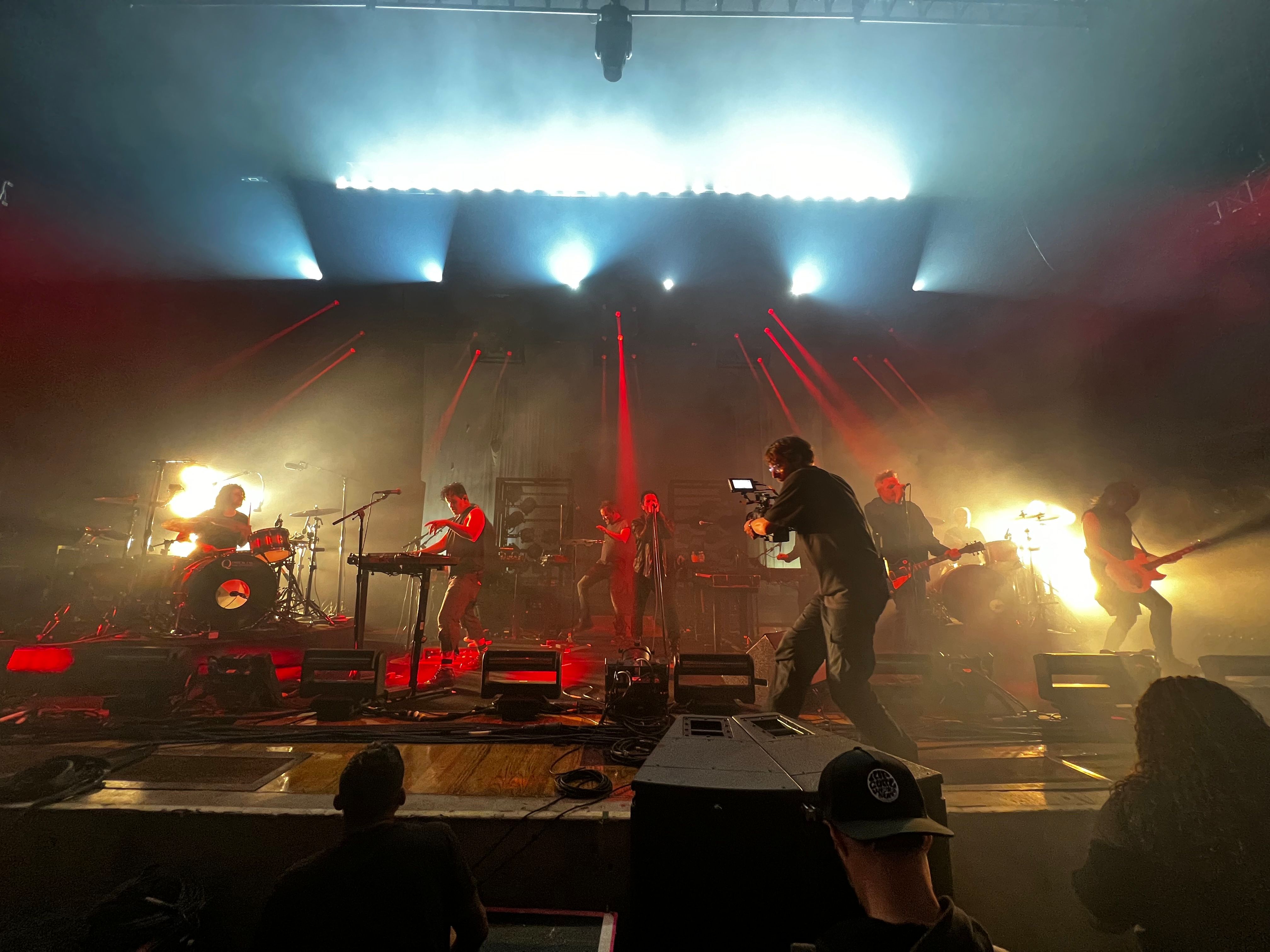 Centre stage photo of Trent Reznor, Atticus Ross and Alessandro Cortini