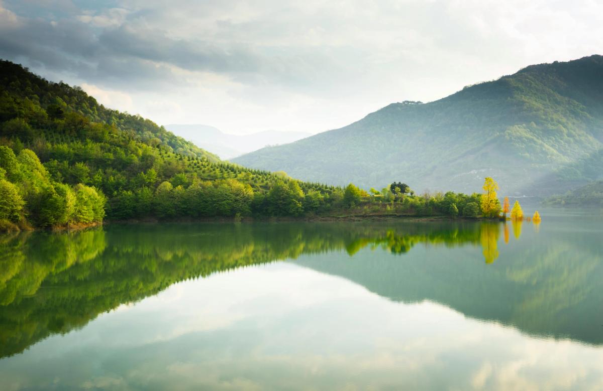 A reflective lake in a valley