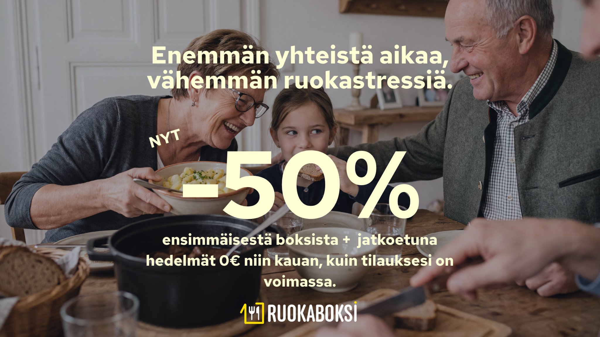 A smiling family, including grandparents and a child, enjoying a meal together. Ad text in Finnish offers "More quality time, less food stress. NOW -50% on the first box + free fruit with subscription." Ruokaboksi logo is visible.