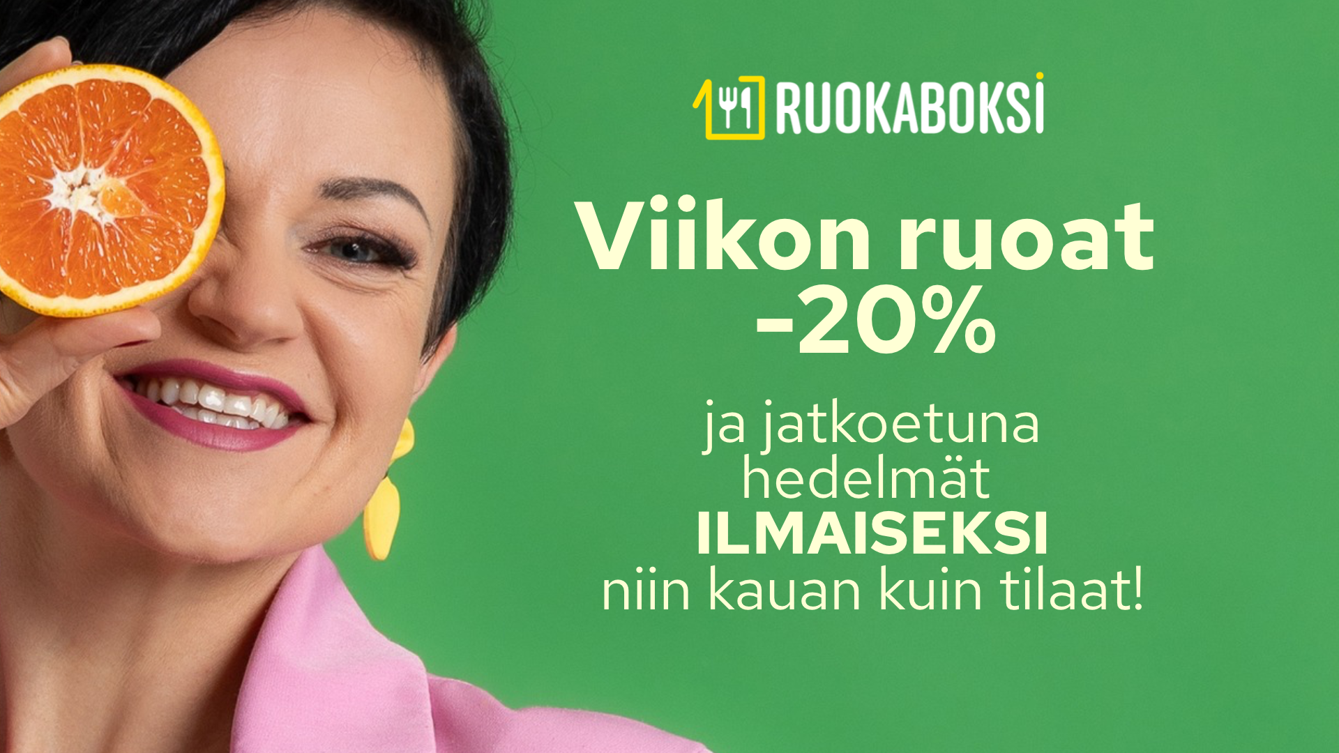 Hedelmät ilmaiseksi, nainen onnellisena appelsiininpuolikas kädessään