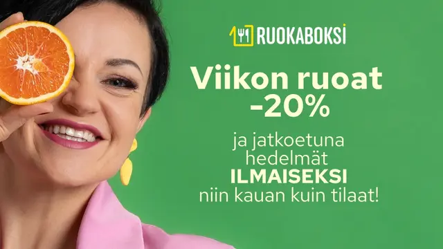 Hedelmät ilmaiseksi, nainen onnellisena appelsiininpuolikas kädessään