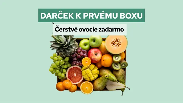 Wooden crate overflowing with various fresh fruits under the text "GIFT FOR THE FIRST BOX" and "Fresh fruit for free."