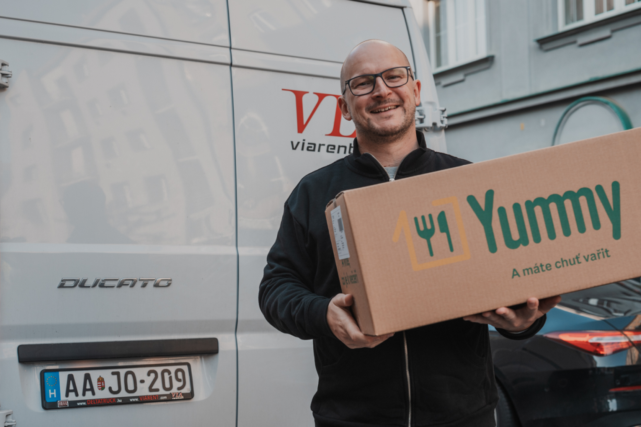 a man delivering Yummy box