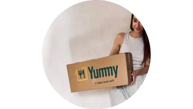 Jana H. holding a box