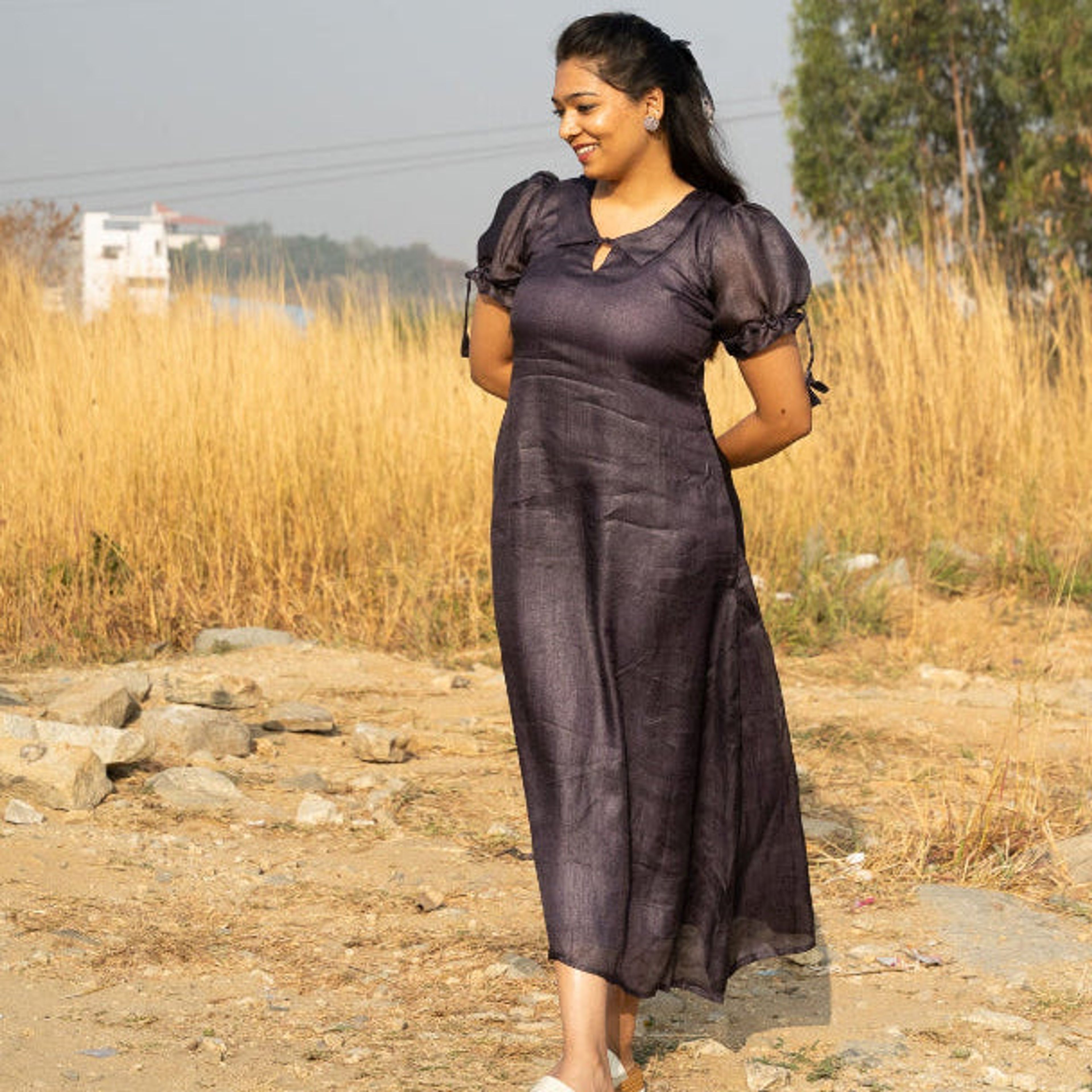 Maxi dress featuring put sleeve tying and Peter Pan collar