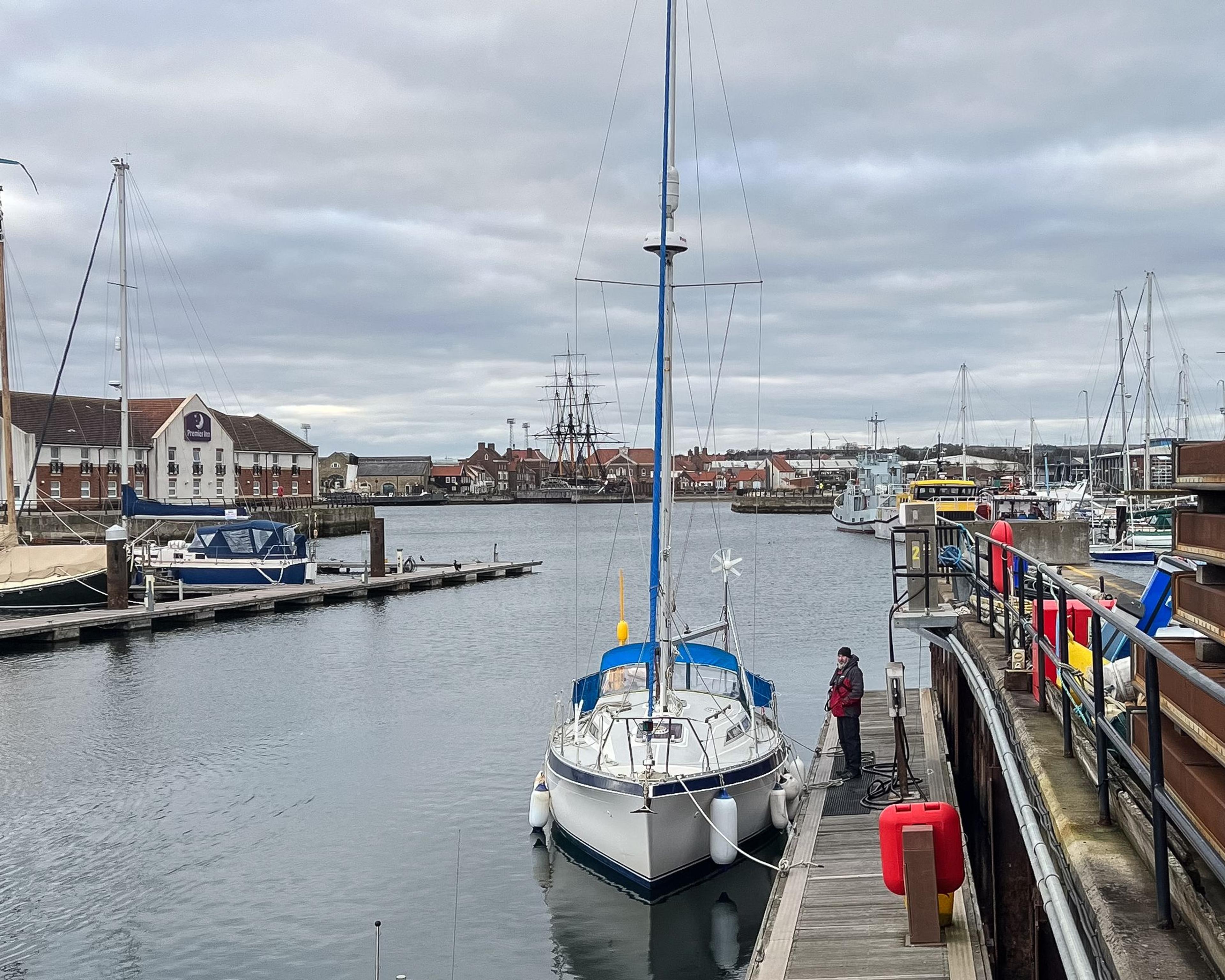 A 30ft yacht moored in a harbour