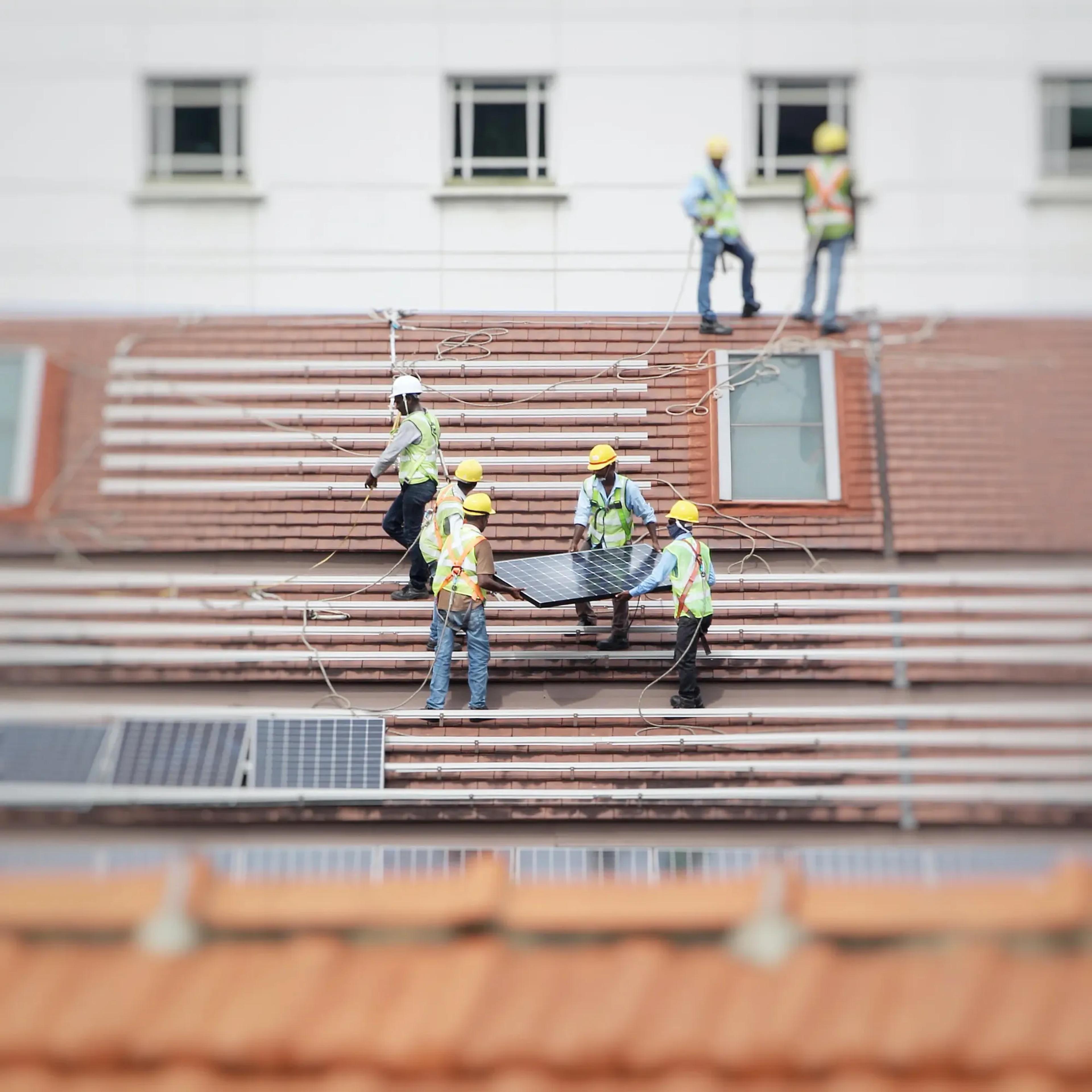 Solar panels being installed on a roof